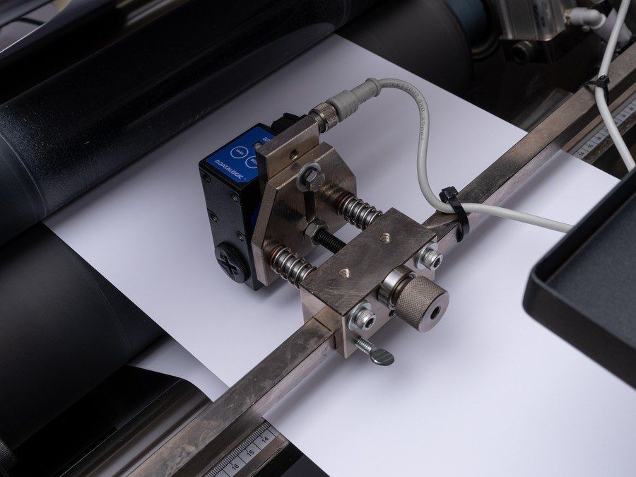 Second-pass scanner mark sensor mounted over the web